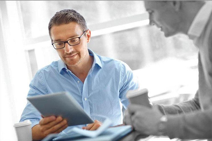 a man holding a tablet