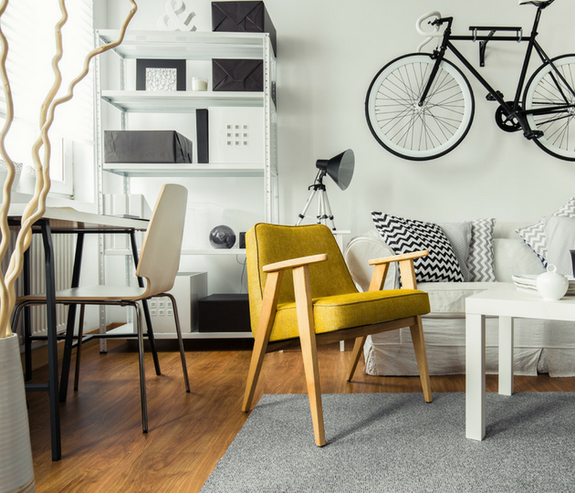 yellow chair in white and black apartment